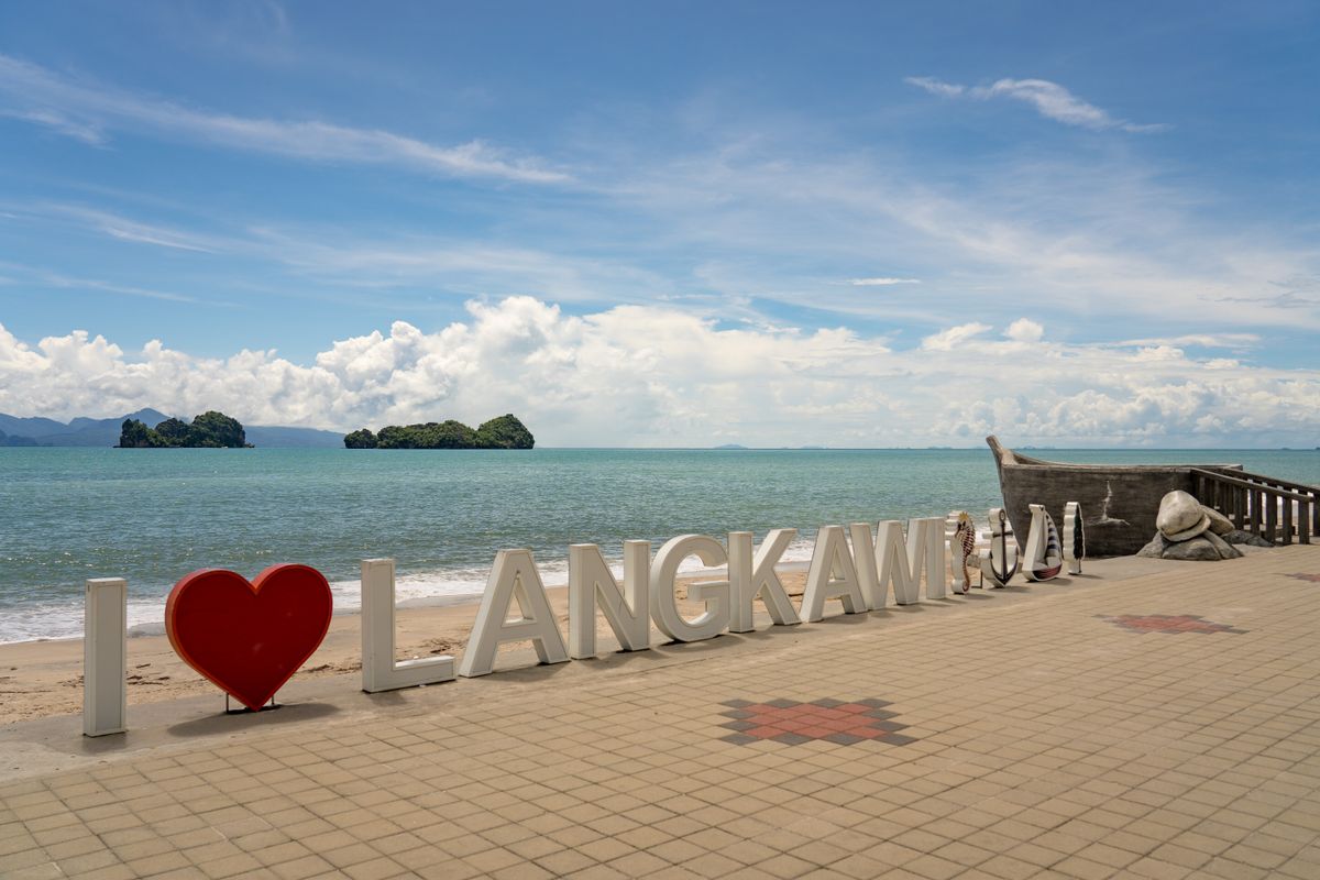 Colourful Langkawi beachfront sign beside the Andaman Sea